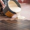 Wood floor adhesive Pallmann P5 pouring onto the floor