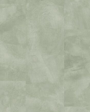 Vinyylilaatta Quick-Step Illume Soft Sage asennettuna modernin kodin lattialle – vaalea, pehmeän salvianvihreä (sage) sävy ja elegantti, hillitty kivimäinen/betonimainen design hienovaraisella tekstuurilla.