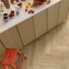 SPC flooring herringbone Quick Step Ciro Botanic Beige installed on Kitchen floor