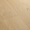 LVT parkett Quick-Step Blos Coast tamm beige heleda tooni ja kergelt oksliku tammest põrandalad disainiga