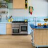Vinyl floor Quick-Step Blos Coast Oak Beige installed on kitchen floor. Kitchen furniture.