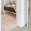 vinyl-tile-flooring-quick-step-illume-soft-blush Vinyl tile flooring Quick-Step Illume Soft blush installed on a bathroom floor. Bathroom furniture.